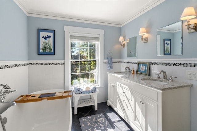 bathroom with vanity, tile walls, crown molding, and tile patterned flooring