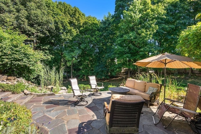 view of patio / terrace featuring an outdoor living space with a fire pit