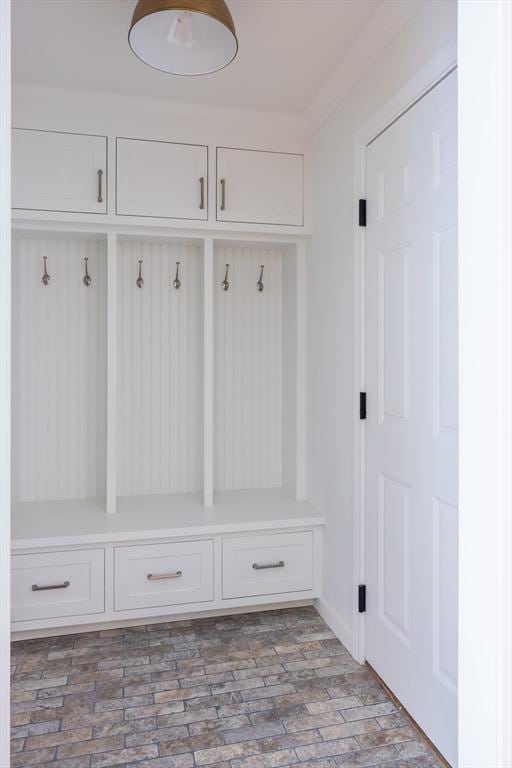 mudroom with brick floor