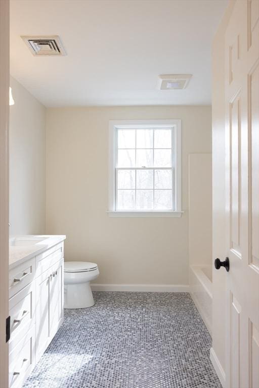 full bath with toilet, baseboards, visible vents, and vanity