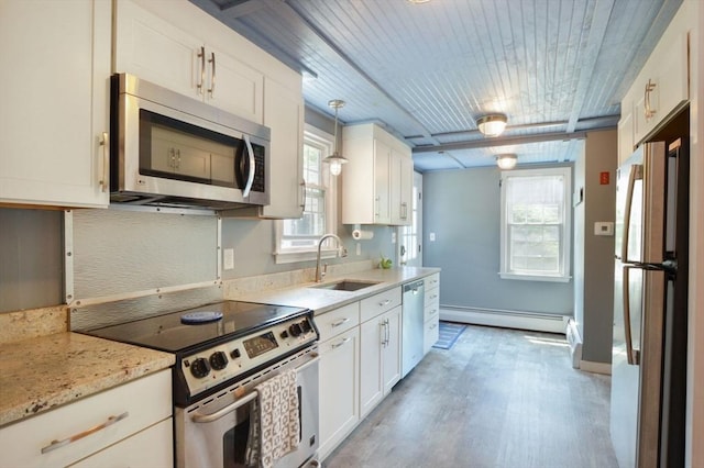 110 Teaticket Path, Falmouth, MA 02536 - kitchen featuring appliances with stainless steel finishes, baseboard heating, white cabinetry, light wood-style flooring, and wood ceiling