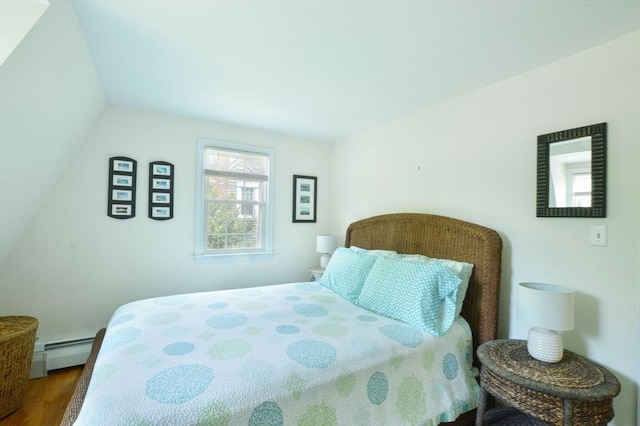 110 Teaticket Path, Falmouth, MA 02536 - bedroom with wood finished floors and a baseboard heating unit