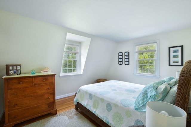 110 Teaticket Path, Falmouth, MA 02536 - bedroom featuring multiple windows and light wood-type flooring