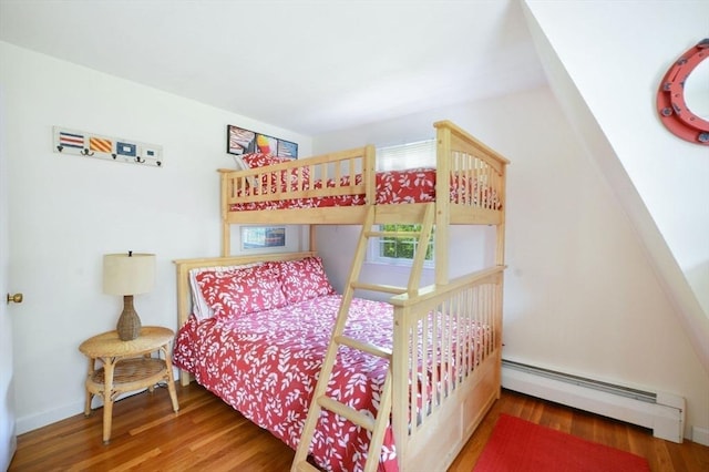 110 Teaticket Path, Falmouth, MA 02536 - bedroom featuring a baseboard radiator and wood finished floors