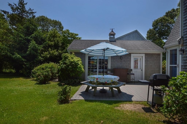 110 Teaticket Path, Falmouth, MA 02536 - back of house with a deck, a yard, outdoor dining space, and a shingled roof