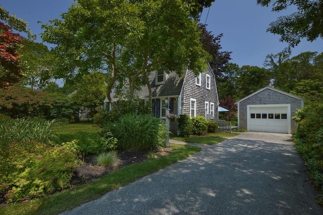 110 Teaticket Path, Falmouth, MA 02536 - view of property exterior with a detached garage, an outbuilding, and driveway