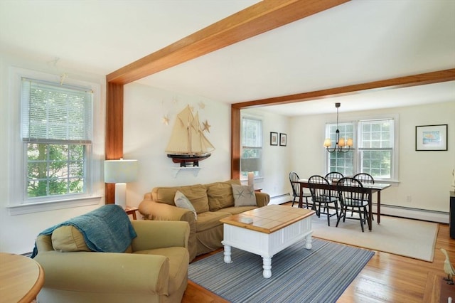 110 Teaticket Path, Falmouth, MA 02536 - living room with healthy amount of natural light, light wood-style flooring, a chandelier, and beamed ceiling