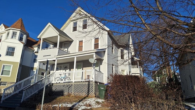 view of front facade with a porch and a balcony