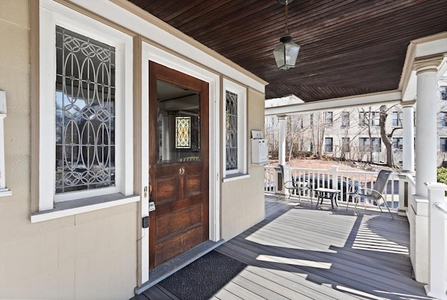 wooden terrace with a porch