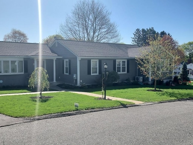 single story home with a front lawn