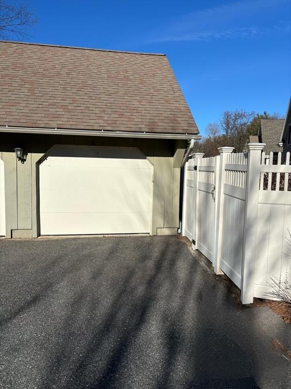 view of side of property featuring a garage