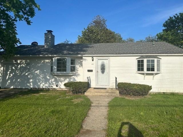 86 Seabrook Rd, Barnstable, MA 02601 - view of front of property with a front yard, a chimney, and a garage