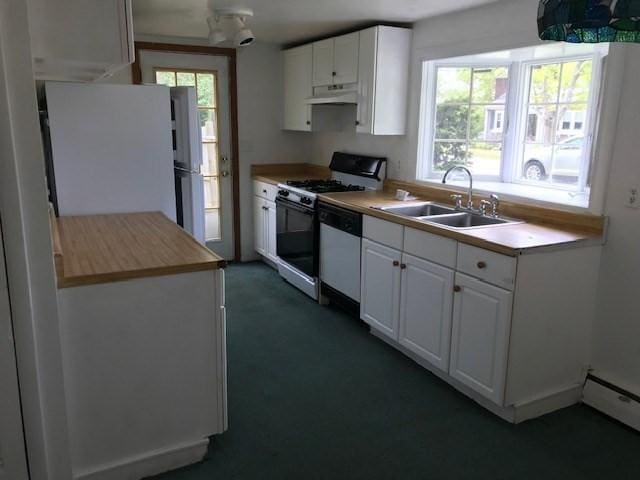86 Seabrook Rd, Barnstable, MA 02601 - kitchen featuring a sink, white appliances, under cabinet range hood, white cabinetry, and baseboard heating