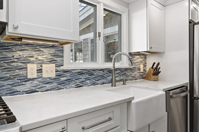 50 Deerfield Rd, Barnstable, MA 02655 - kitchen with white cabinetry, decorative backsplash, and dishwasher