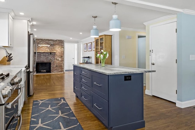 50 Deerfield Rd, Barnstable, MA 02655 - kitchen featuring crown molding, decorative light fixtures, appliances with stainless steel finishes, dark wood-style floors, and white cabinets