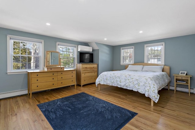 50 Deerfield Rd, Barnstable, MA 02655 - bedroom featuring recessed lighting, a wall unit AC, multiple windows, and wood finished floors