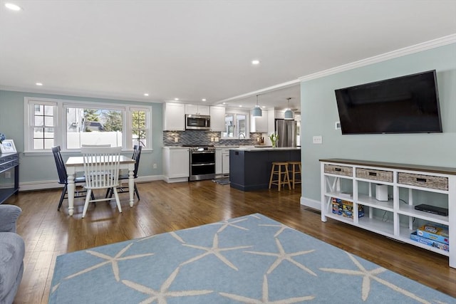50 Deerfield Rd, Barnstable, MA 02655 - living area featuring baseboards, dark wood-style floors, and ornamental molding