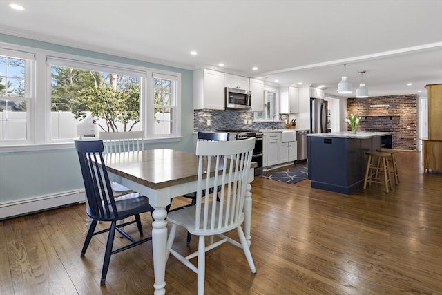 50 Deerfield Rd, Barnstable, MA 02655 - dining space with dark wood-style flooring, ornamental molding, a baseboard heating unit, and recessed lighting