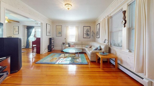 118 Colby Rd, Quincy, MA 02171 - living area featuring crown molding, a baseboard radiator, wood finished floors, ceiling fan, and a baseboard heating unit