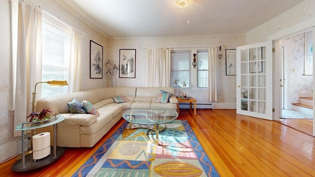 118 Colby Rd, Quincy, MA 02171 - living room featuring baseboard heating, ornamental molding, wallpapered walls, and wood finished floors