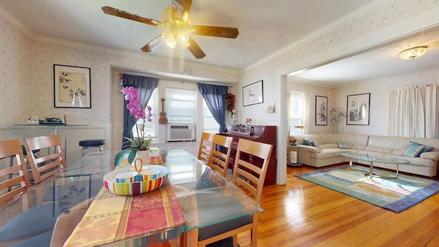 118 Colby Rd, Quincy, MA 02171 - dining space featuring wallpapered walls, wood finished floors, a ceiling fan, crown molding, and wainscoting