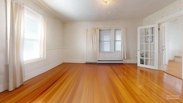 118 Colby Rd, Quincy, MA 02171 - spare room featuring ornamental molding, a baseboard radiator, wood finished floors, and healthy amount of natural light