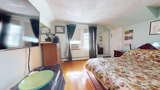 118 Colby Rd, Quincy, MA 02171 - bedroom with wood finished floors, lofted ceiling, baseboard heating, and cooling unit