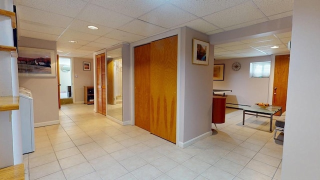 118 Colby Rd, Quincy, MA 02171 - hall featuring a drop ceiling, baseboard heating, washer / dryer, recessed lighting, and light tile patterned floors