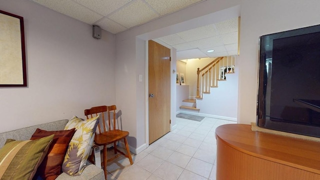 118 Colby Rd, Quincy, MA 02171 - hall featuring a paneled ceiling, stairway, and light tile patterned flooring