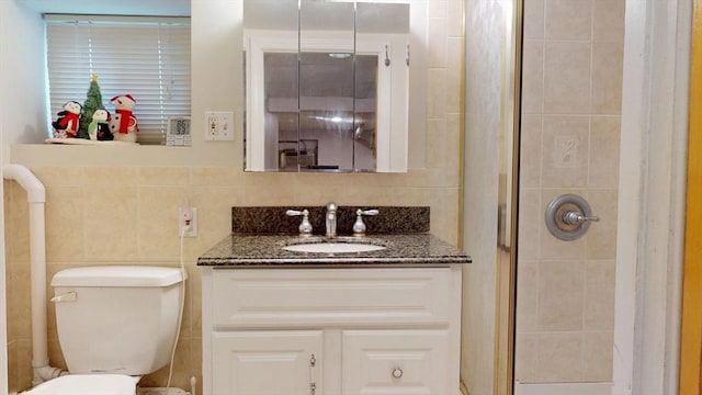 118 Colby Rd, Quincy, MA 02171 - bathroom featuring a shower stall, vanity, and tile walls