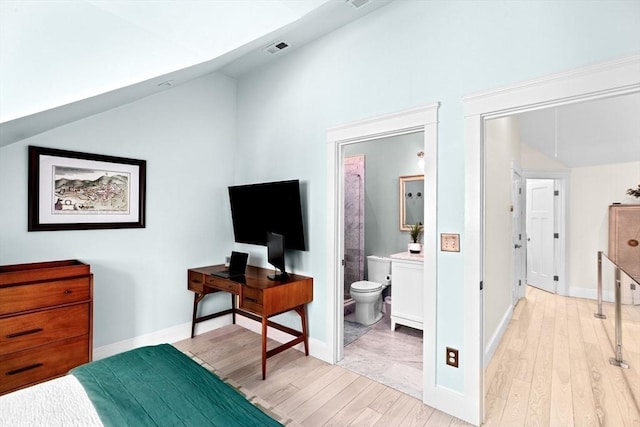 bedroom featuring baseboards, visible vents, light wood-type flooring, and lofted ceiling