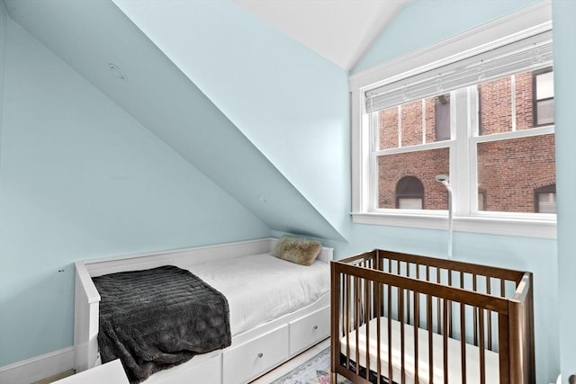 bedroom with lofted ceiling