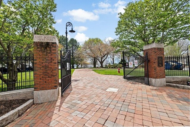 view of gate featuring a fenced front yard