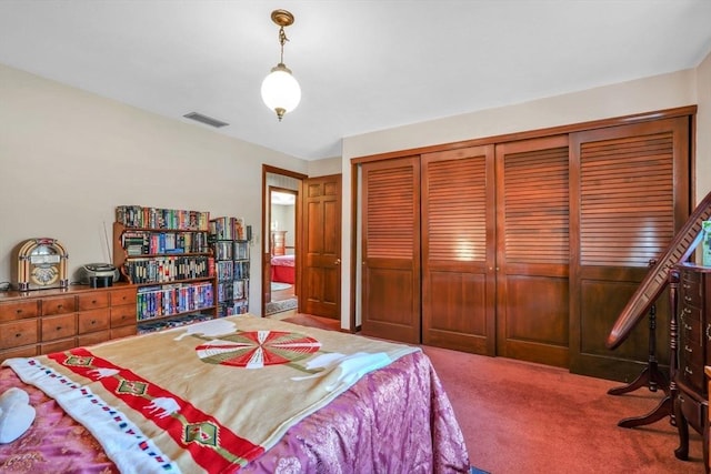 carpeted bedroom with a closet