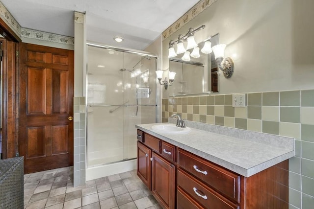 bathroom featuring vanity and an enclosed shower