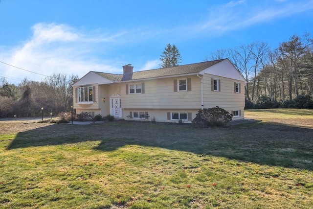 bi-level home with a front yard