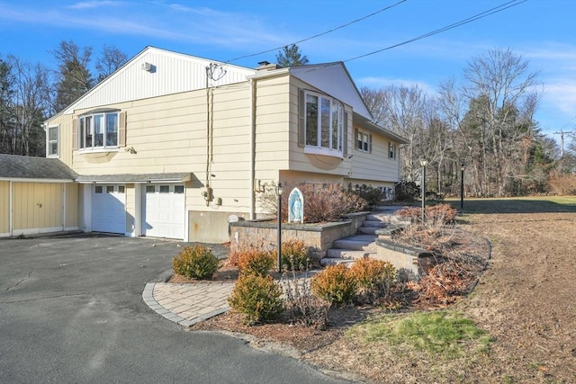 view of side of property with a garage