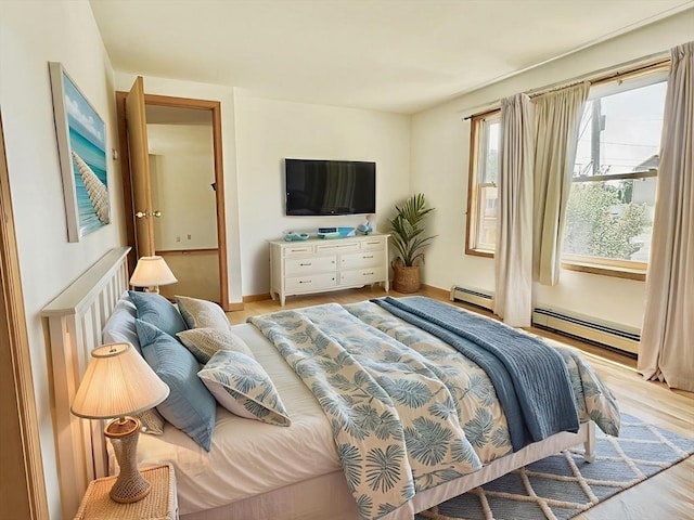 3 Teal Cir, Fairhaven, MA 02719 - bedroom with a baseboard heating unit and wood finished floors