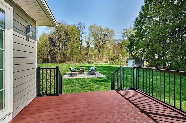 wooden deck with a lawn and a patio area