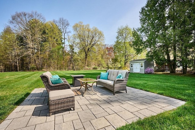 view of patio / terrace with outdoor lounge area and an outbuilding