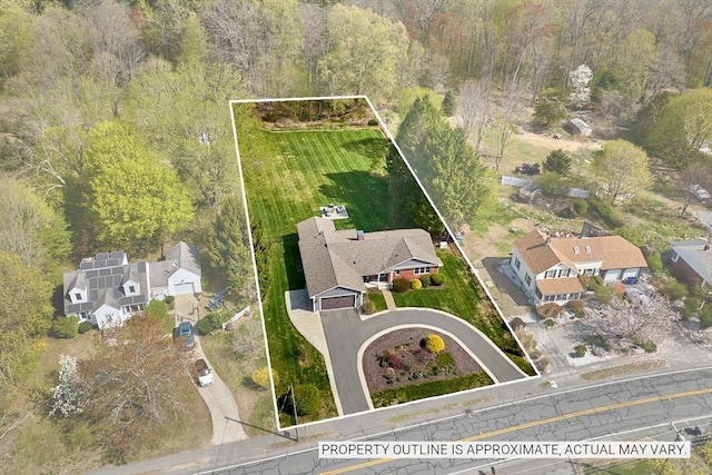 bird's eye view with a residential view and a wooded view