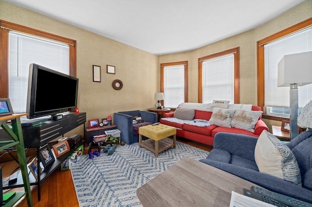 living room with wood finished floors and healthy amount of natural light