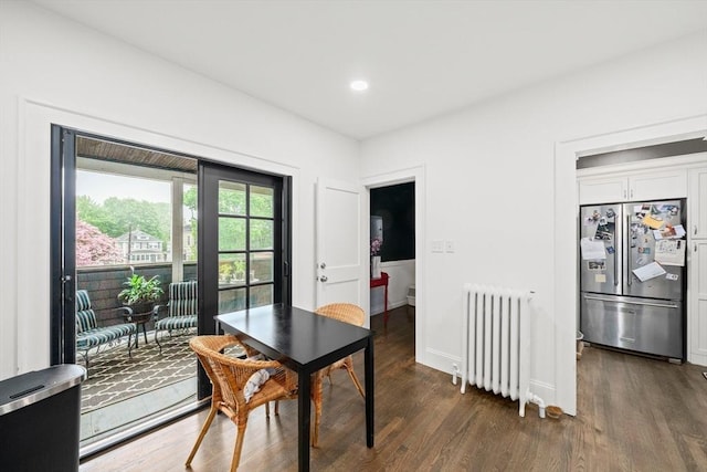 dining area with radiator, dark wood-style floors, baseboards, and recessed lighting