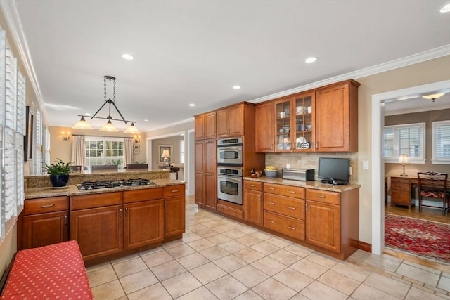 kitchen with backsplash, glass insert cabinets, crown molding, appliances with stainless steel finishes, and brown cabinetry