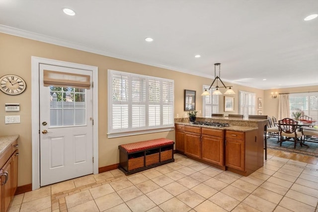 kitchen featuring a peninsula, recessed lighting, pendant lighting, crown molding, and brown cabinets