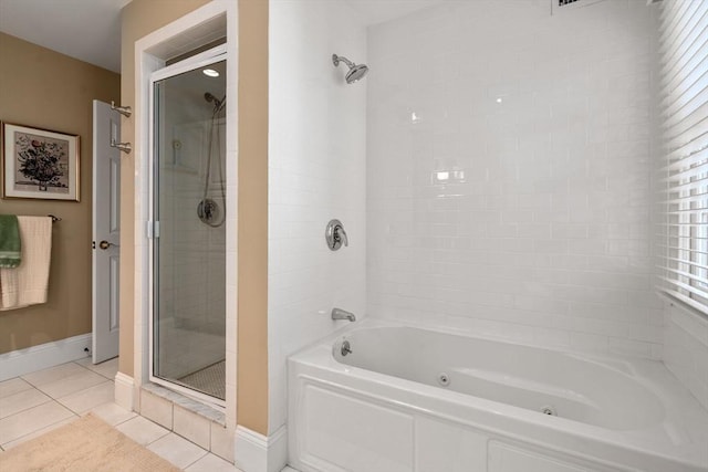 bathroom featuring a tile shower, tile patterned floors, a jetted tub, and baseboards