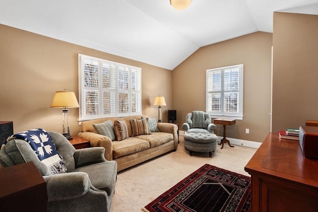 carpeted living room with baseboards and lofted ceiling