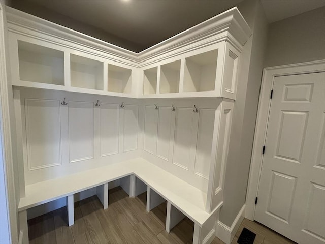 mudroom with wood-type flooring