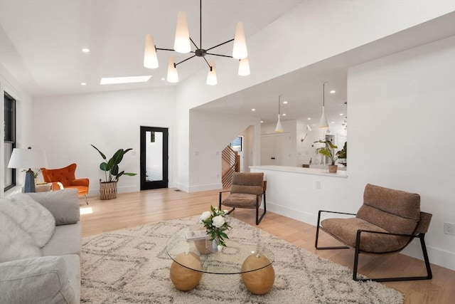 216 Aspinwall Ave, Brookline, MA 02446 - living room with wood finished floors, baseboards, recessed lighting, and high vaulted ceiling