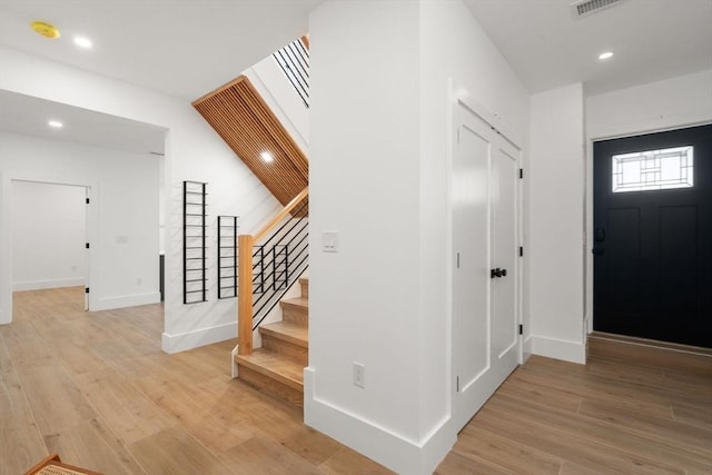 216 Aspinwall Ave, Brookline, MA 02446 - foyer entrance with stairway, light wood-style flooring, recessed lighting, and baseboards